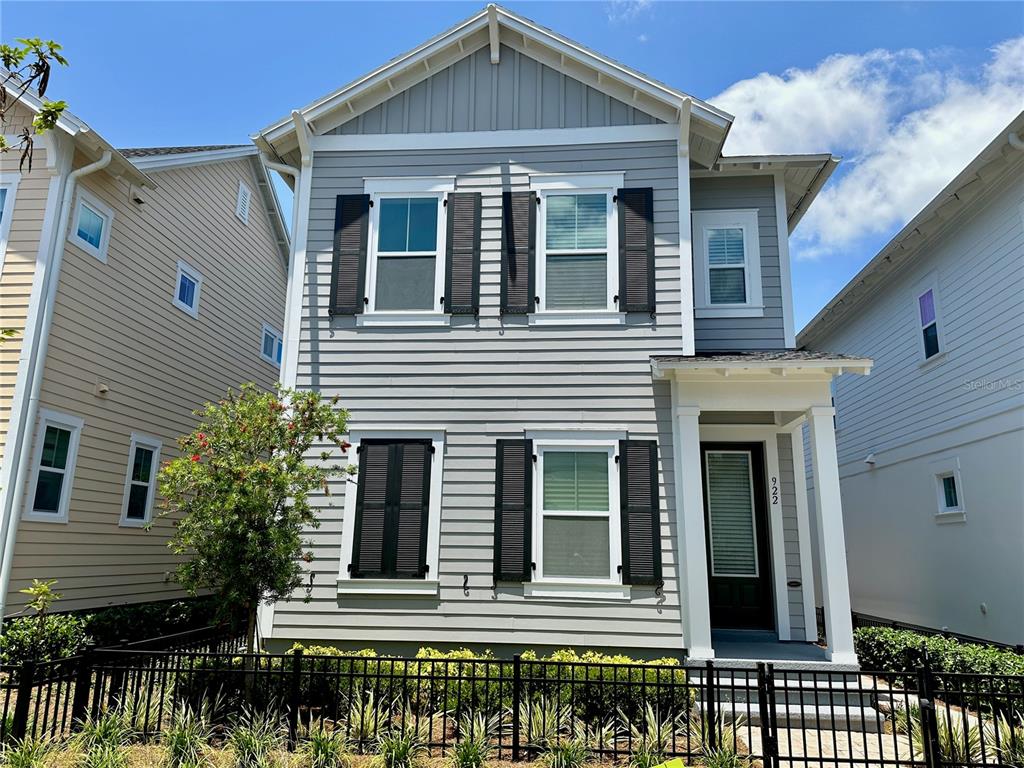 a front view of a house with a lots of windows