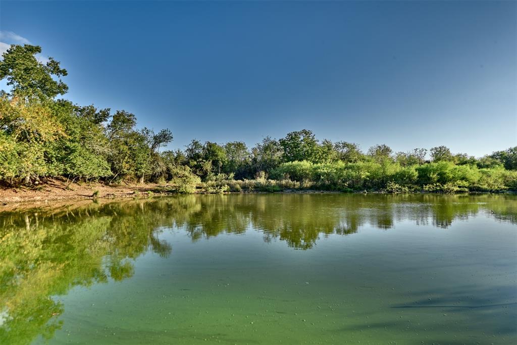 a view of a lake with houses in the background