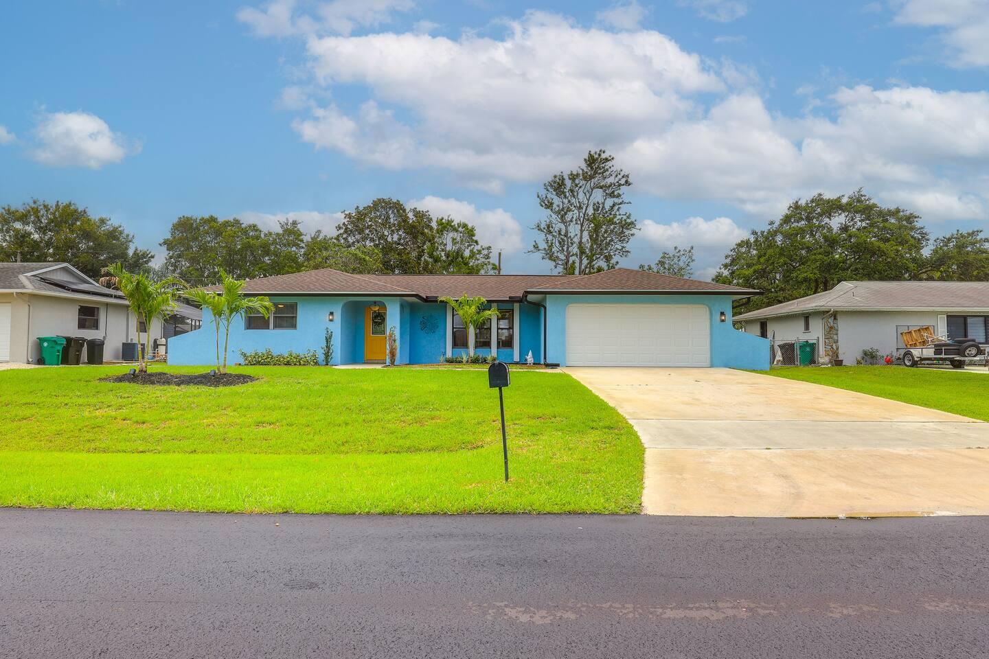 front view of a house next to a yard