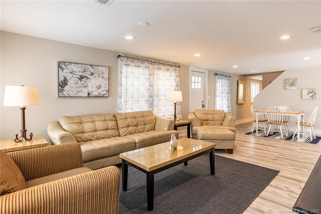 a living room with furniture and a lamp