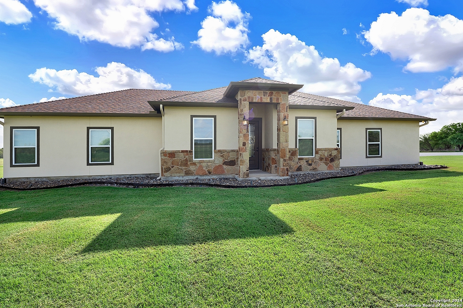 a front view of house with yard