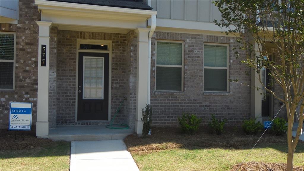 a view of house with yard