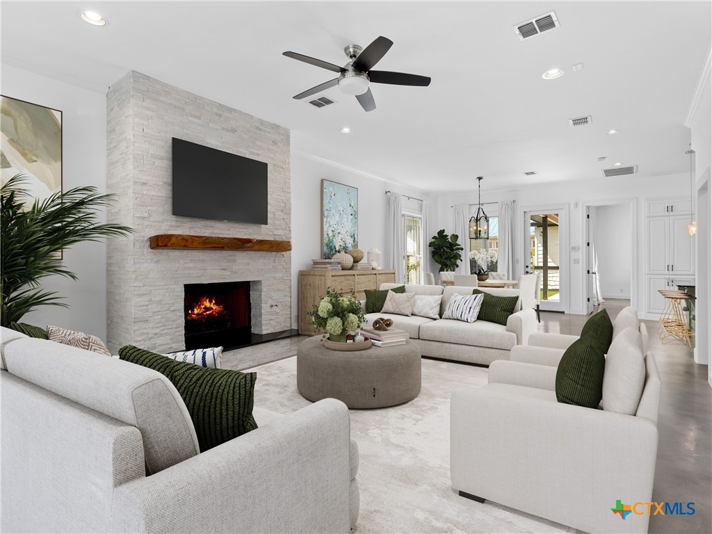 a living room with furniture fireplace and a flat screen tv