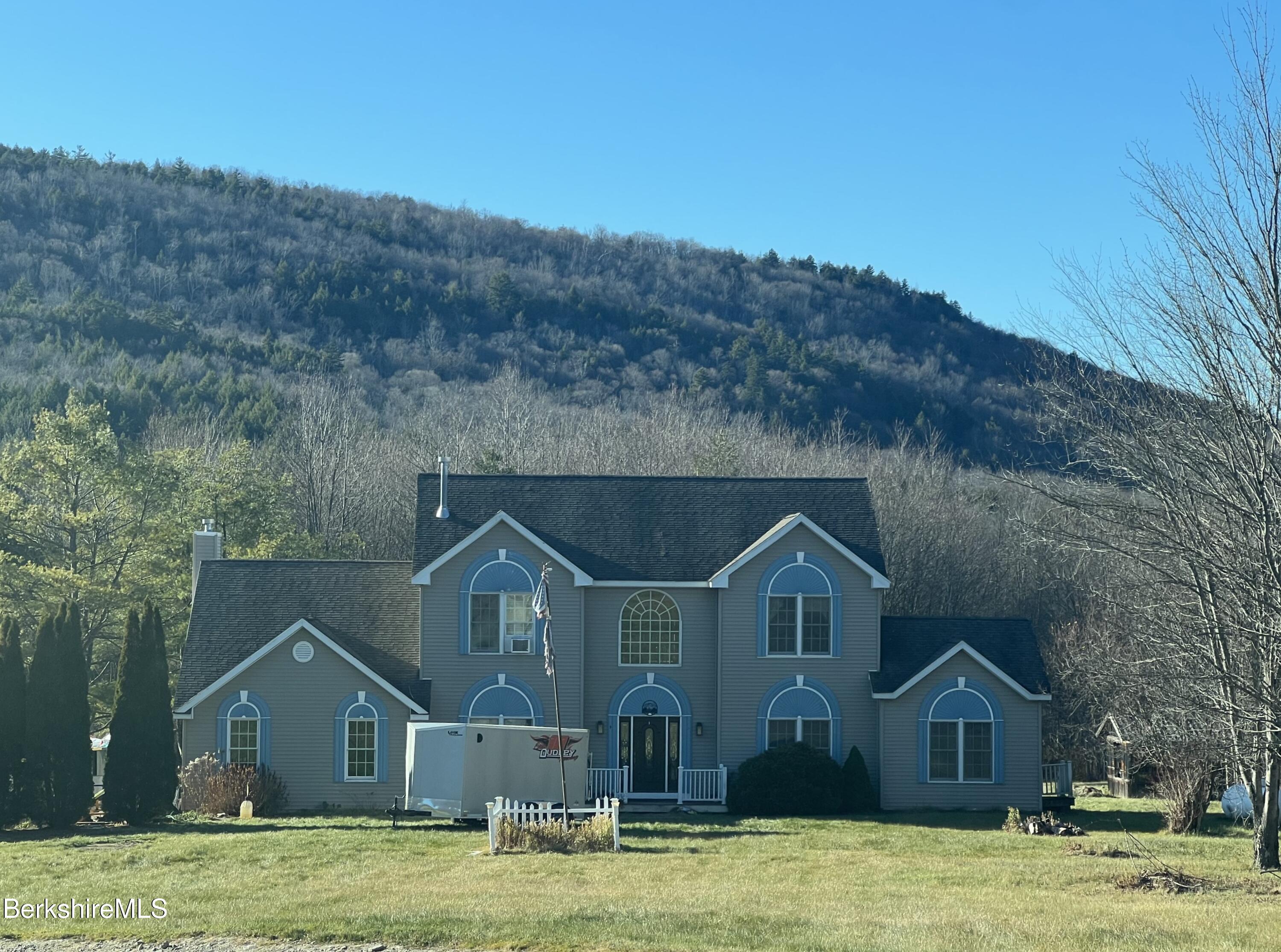 a front view of a house with a yard