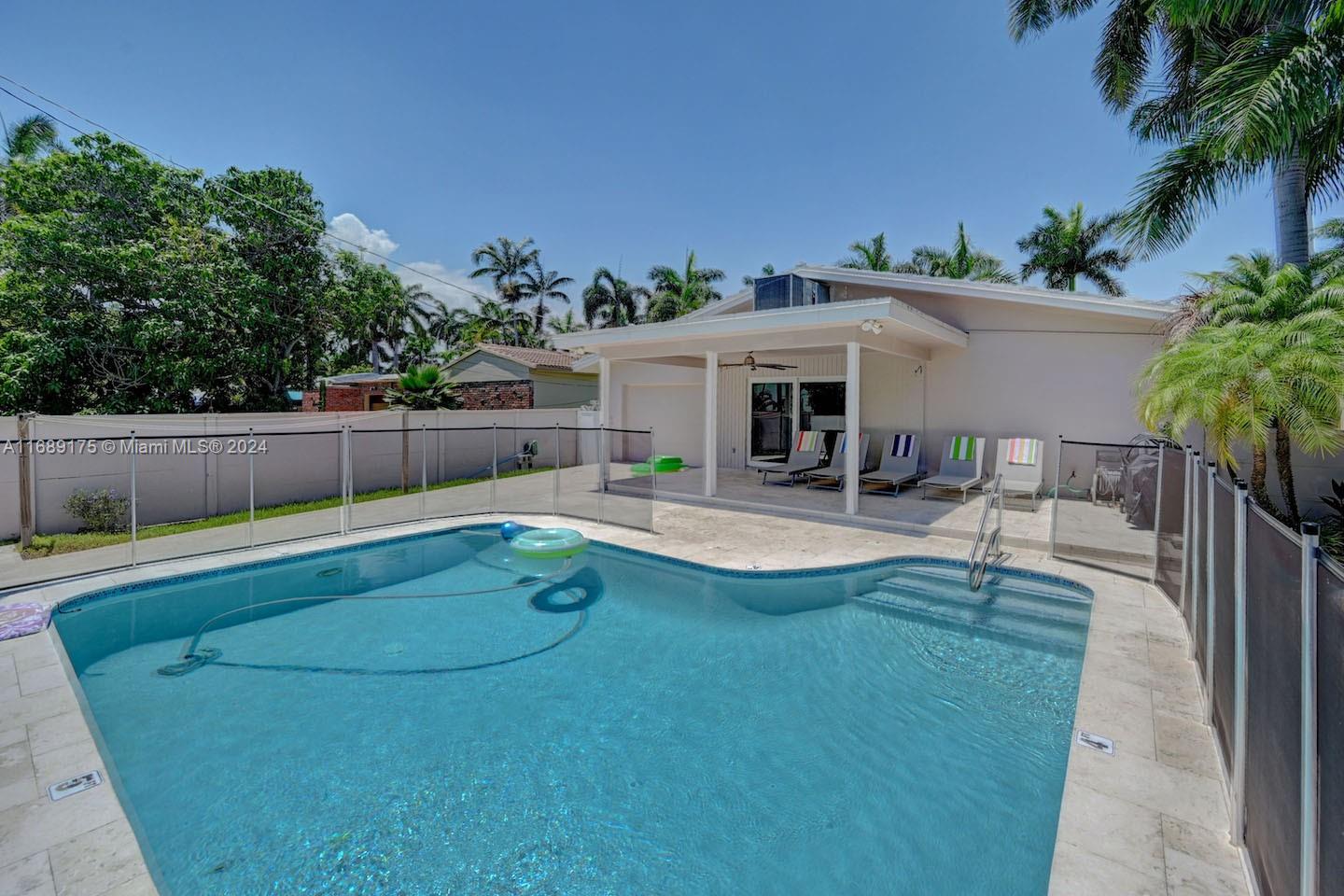 a view of a swimming pool with a patio