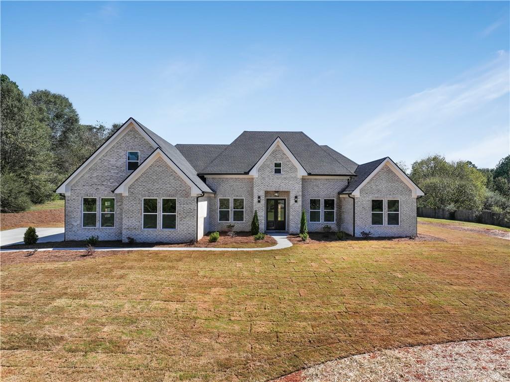 a front view of a house with a yard