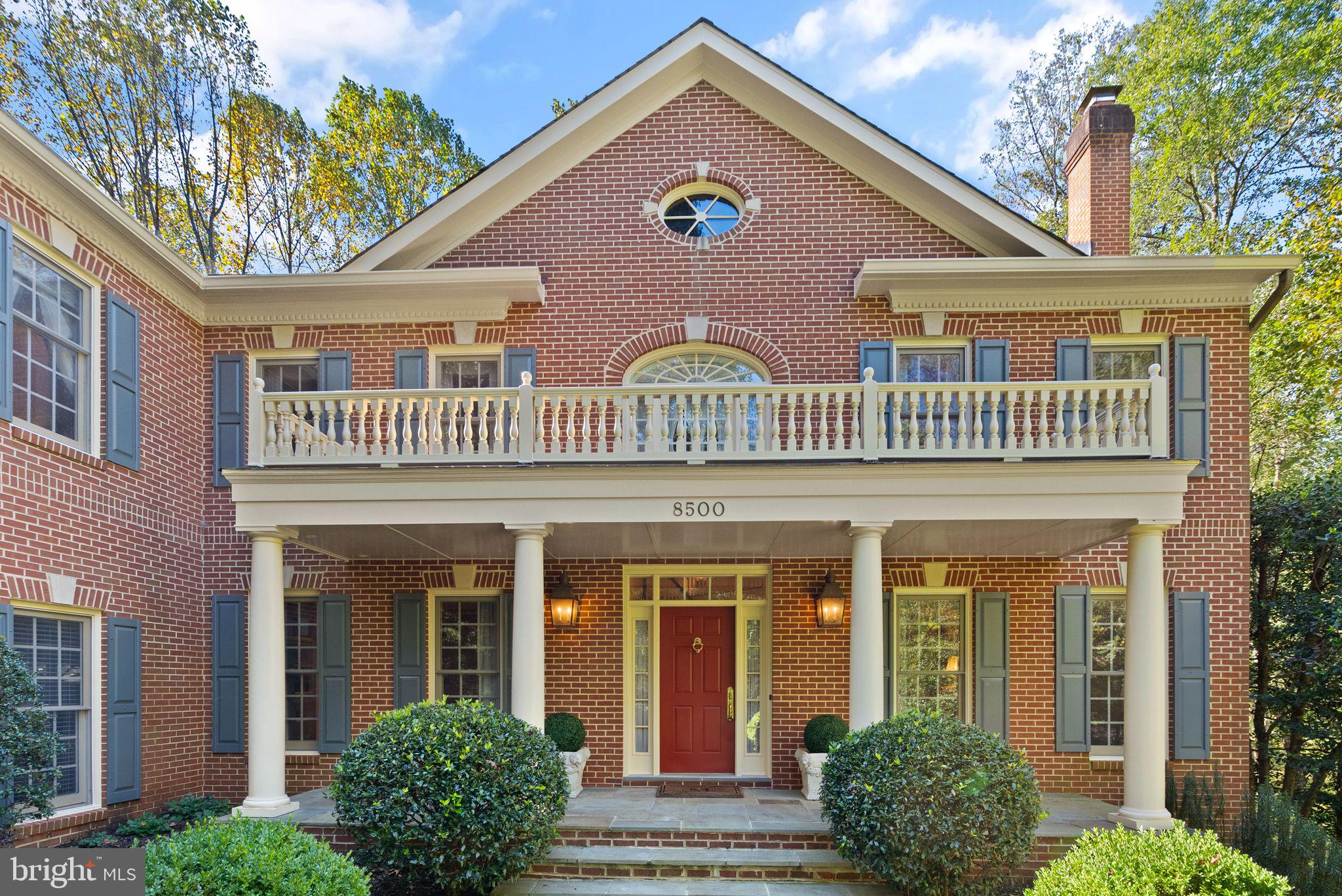 front view of a brick house with a windows