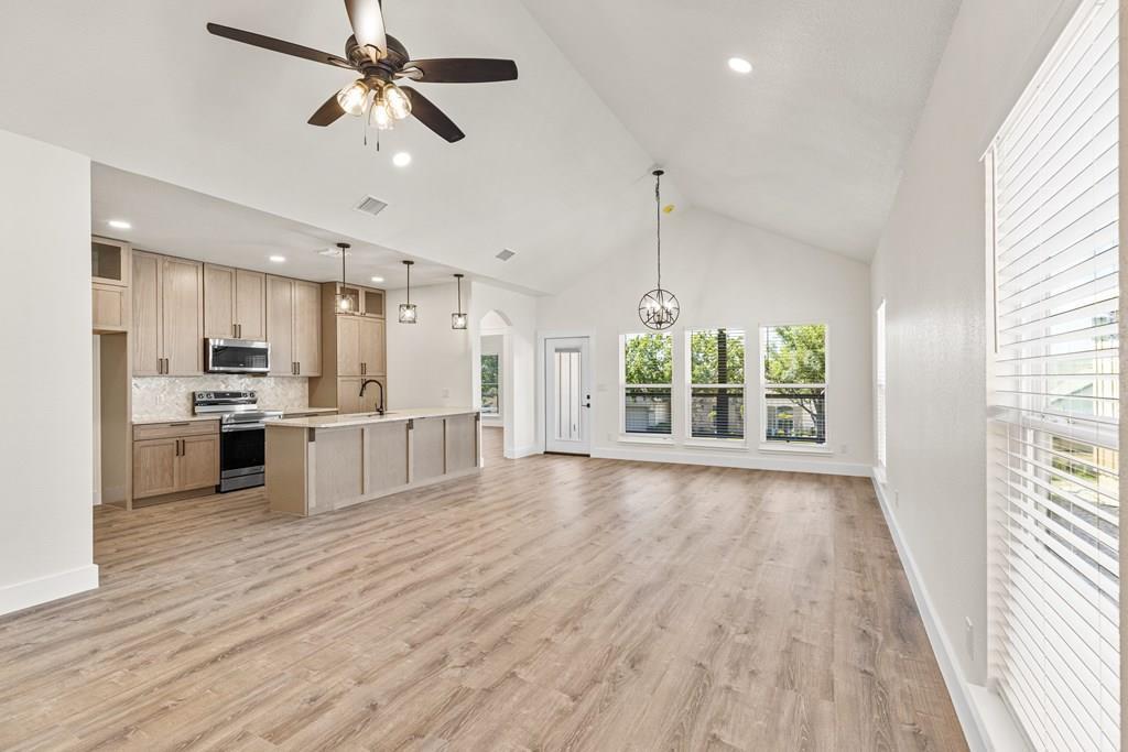 a view of kitchen with wooden floor and window