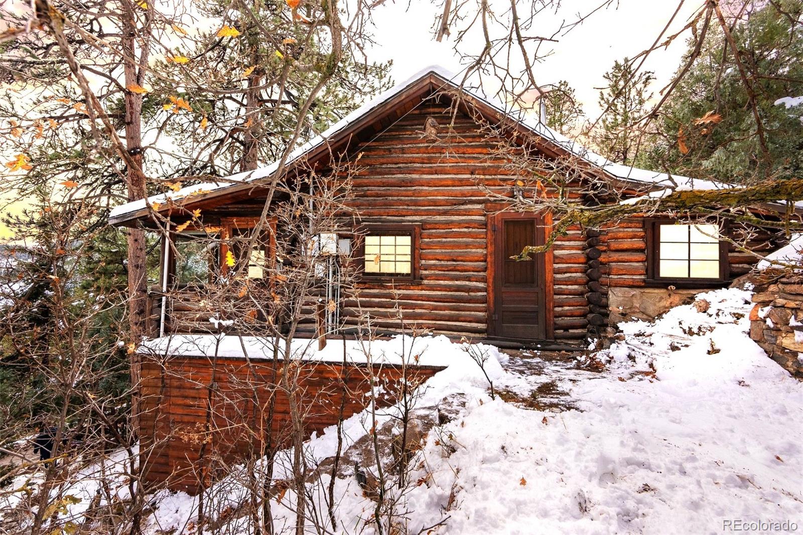 a view of a house with snow on the road