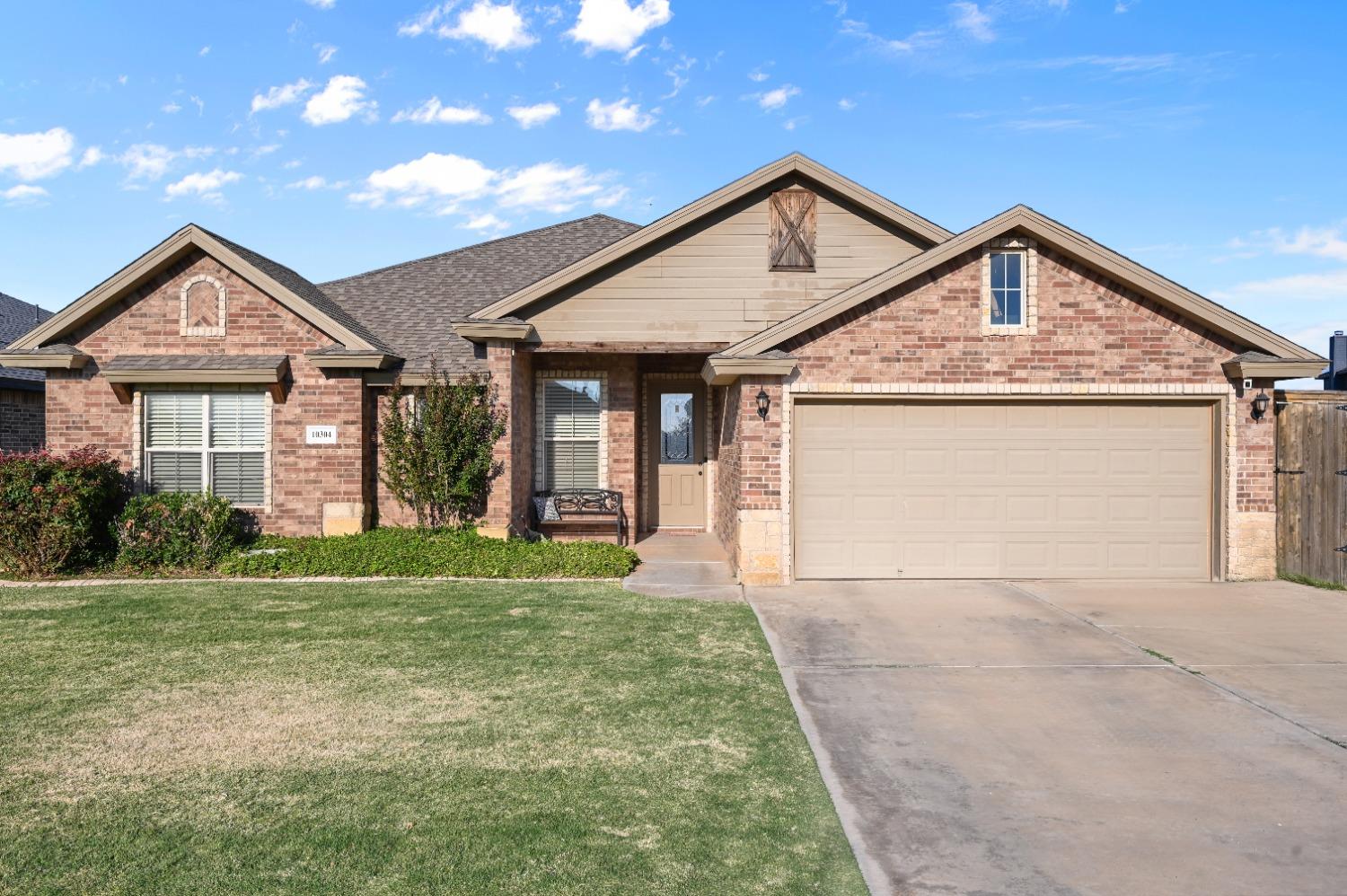 a front view of a house with yard