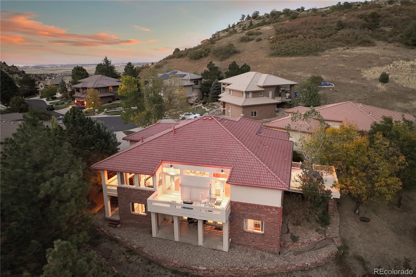 an aerial view of a house with a yard basket ball court and outdoor seating