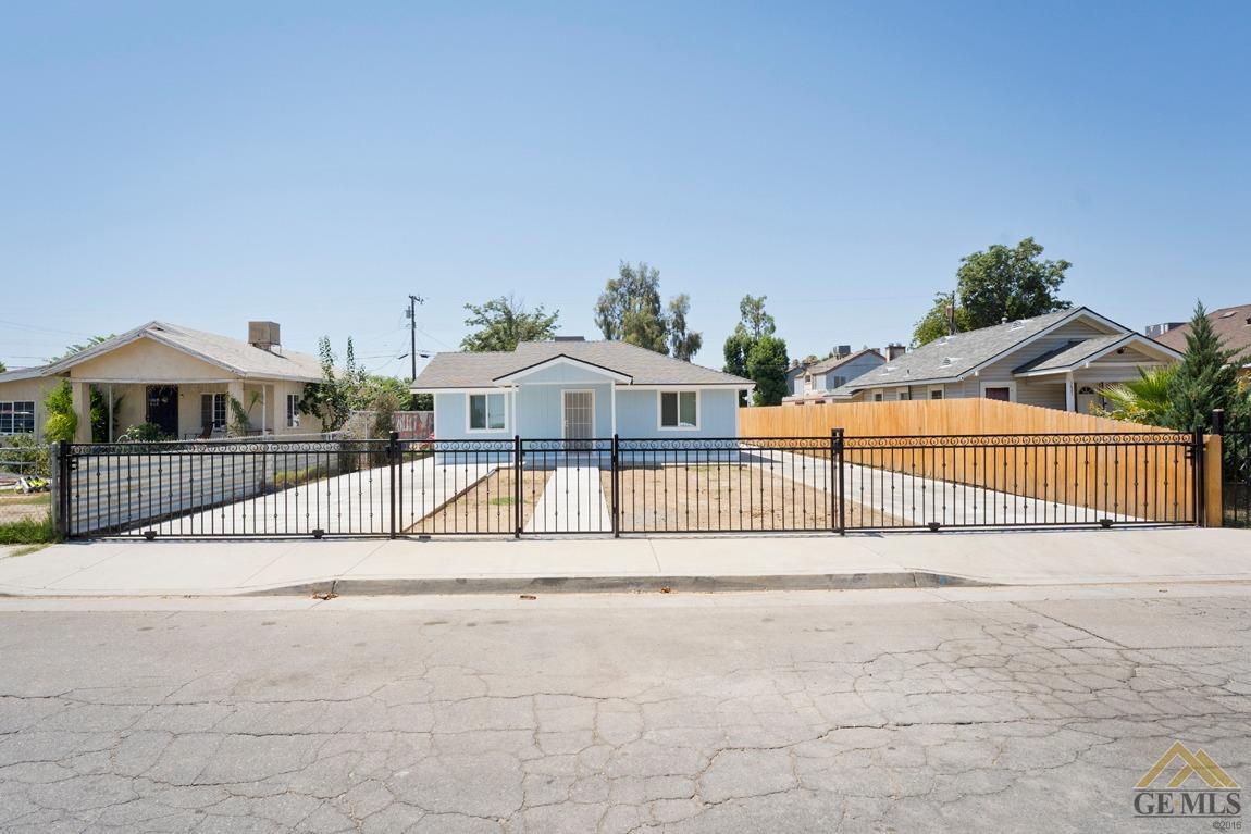 a view of houses with wooden fence