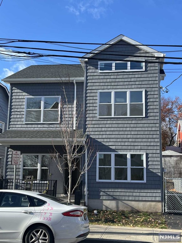 a front view of a house with parking