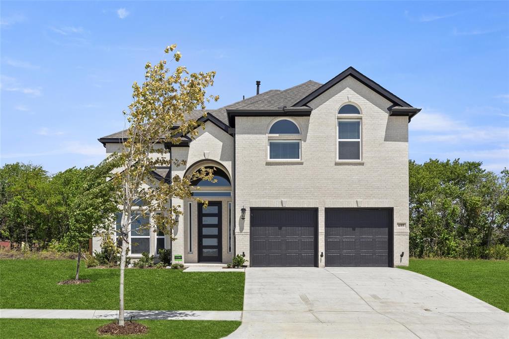 a front view of a house with a yard