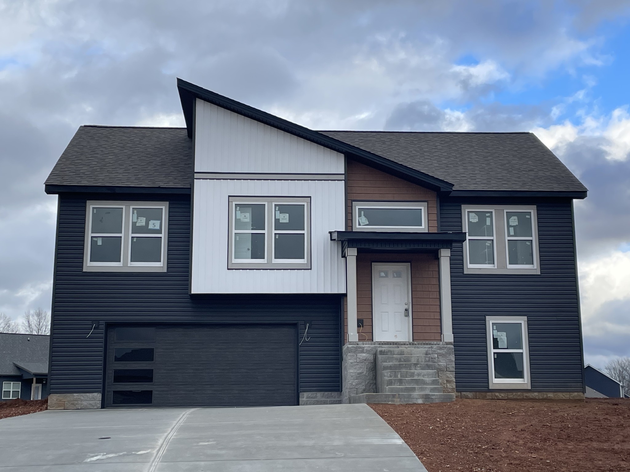 a front view of a house with a garage