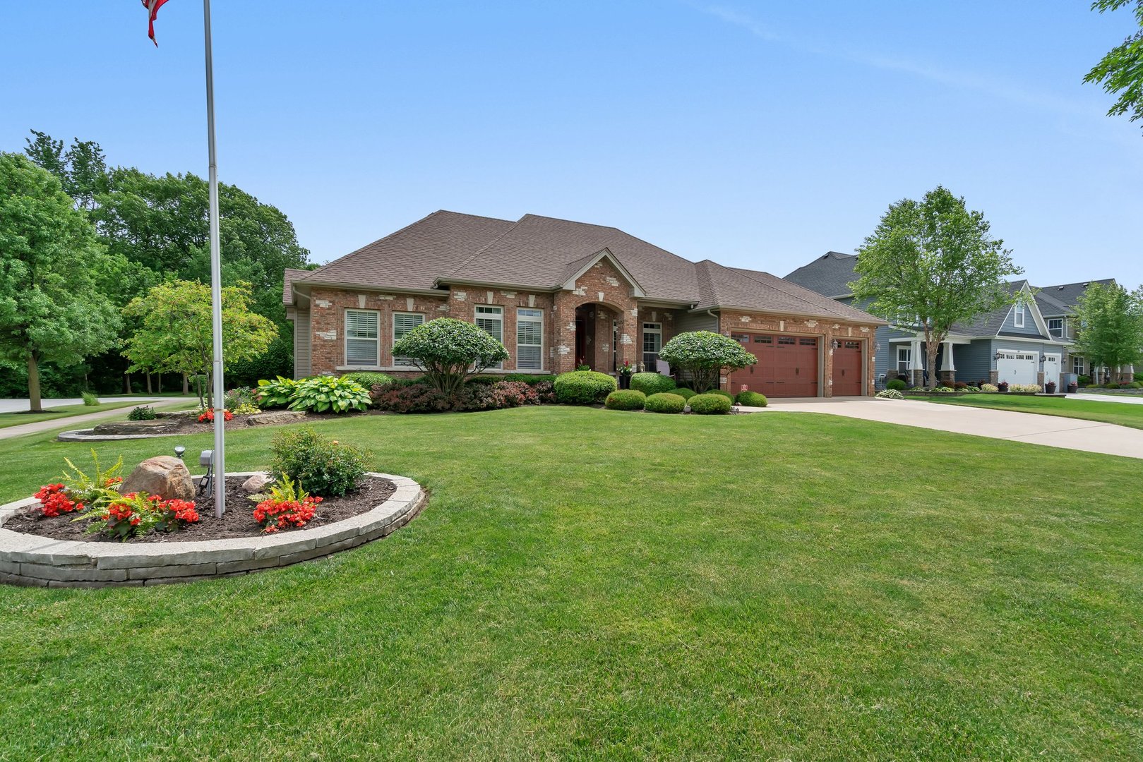 a front view of a house with a garden and plants