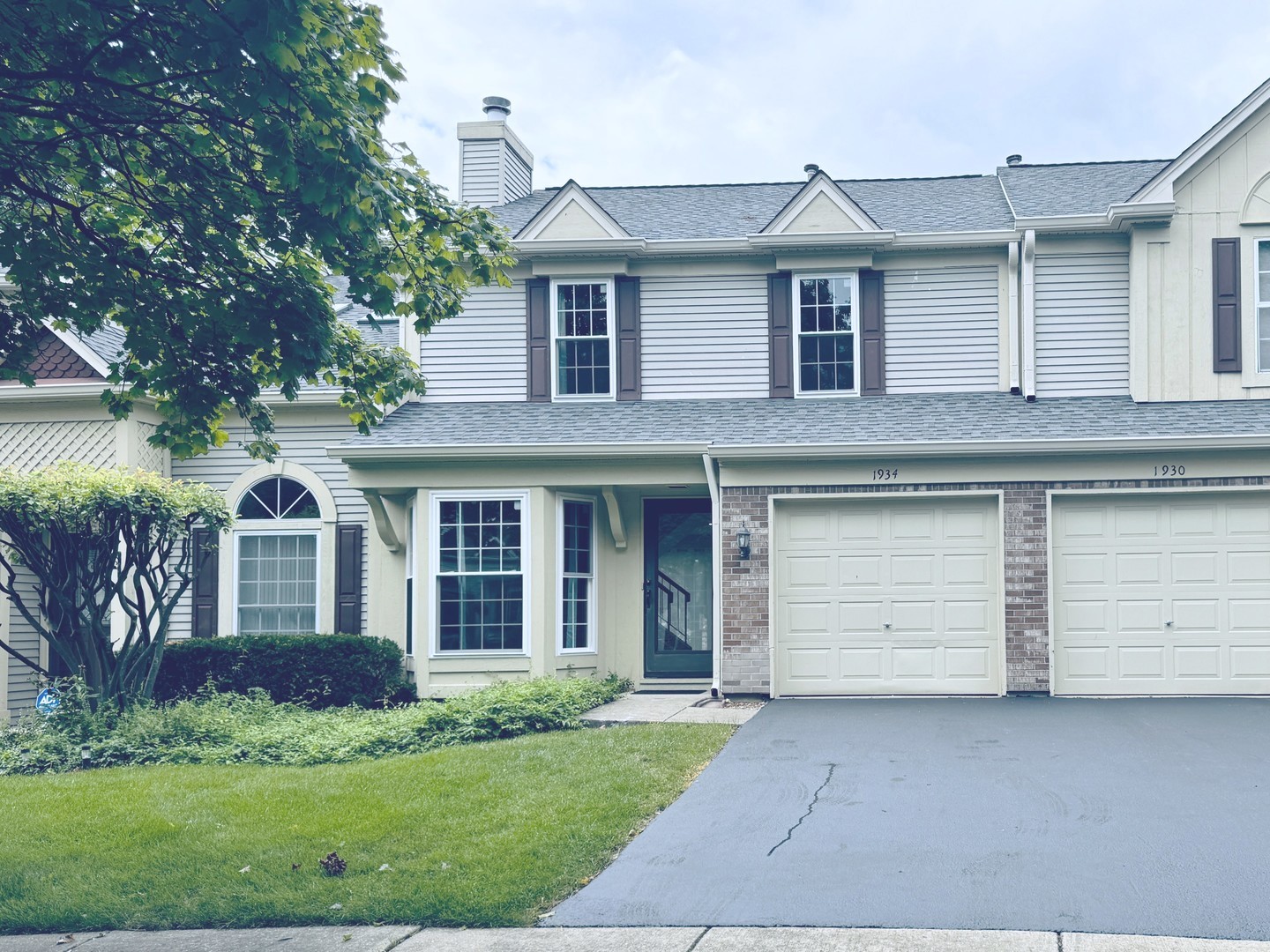 front view of a house and a yard