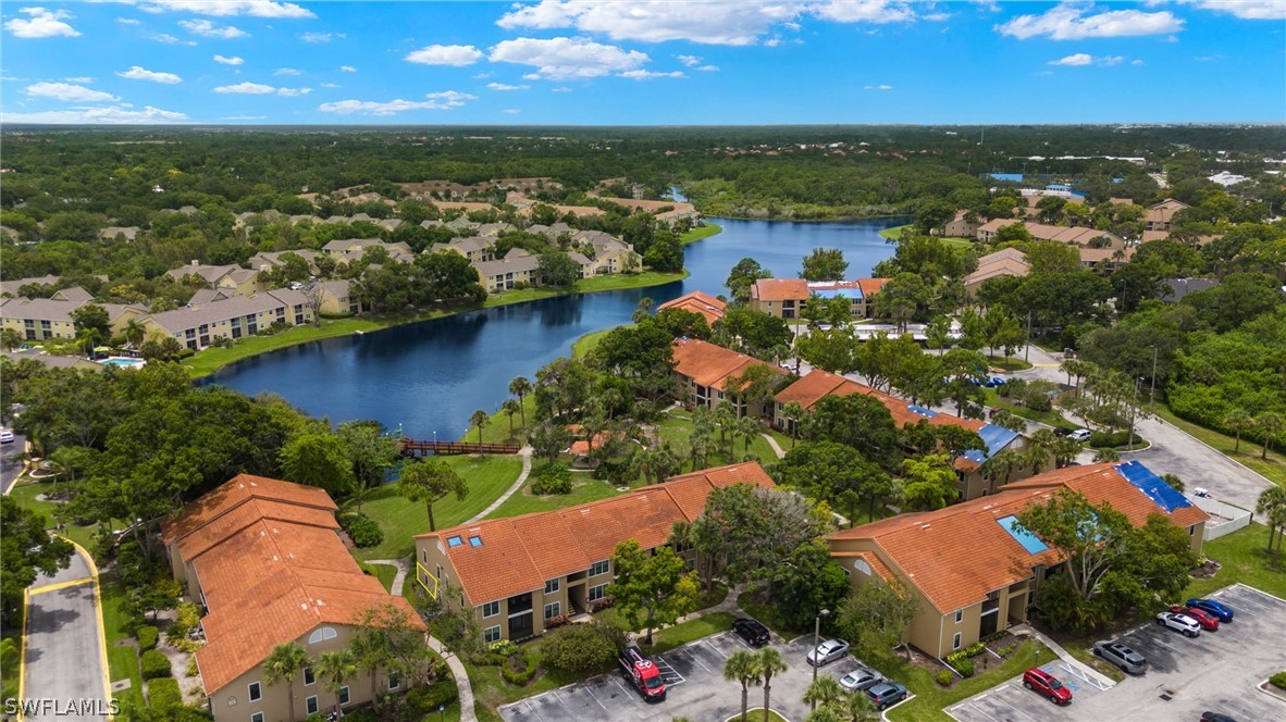 an aerial view of ocean residential house with outdoor space and trees all around