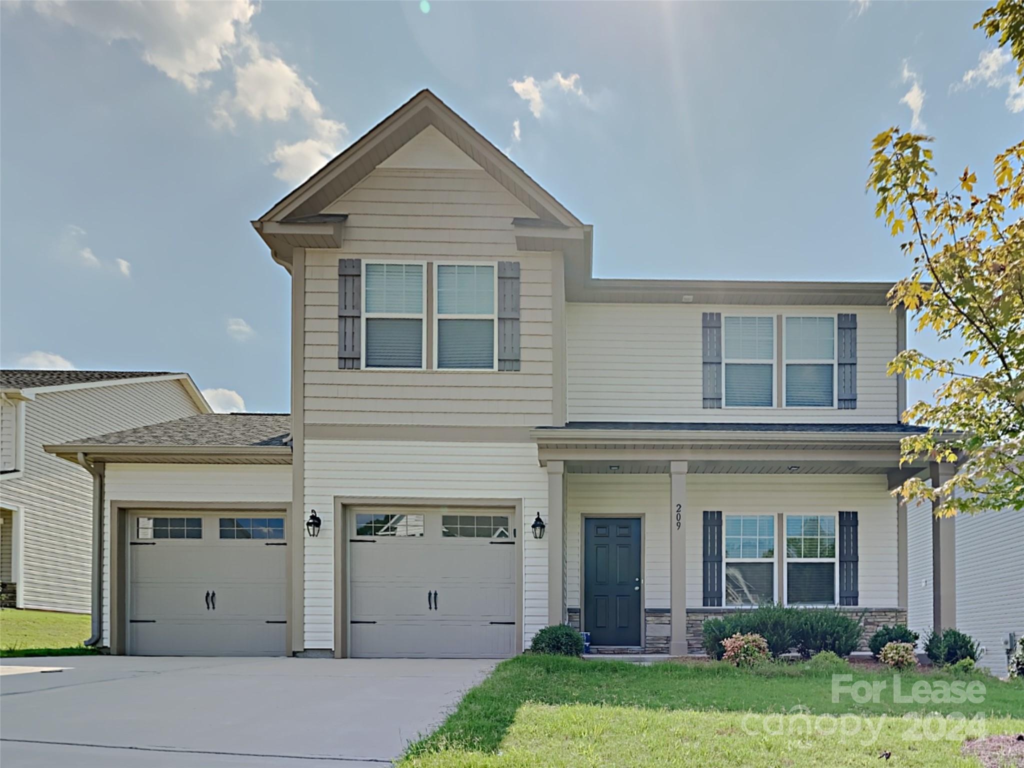 front view of a house with a yard