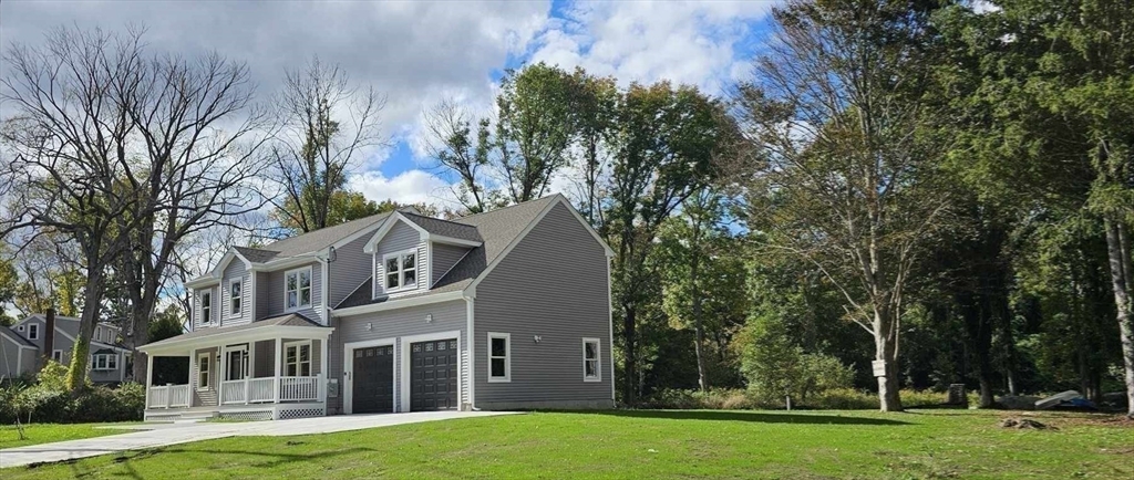 front view of a house with a yard