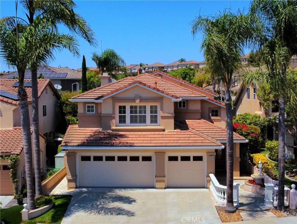 a house with palm tree in front of it