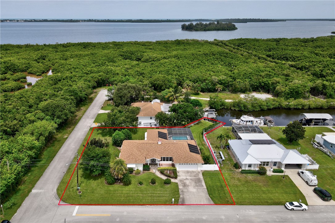 an aerial view of a house with outdoor space swimming pool outdoor seating and yard