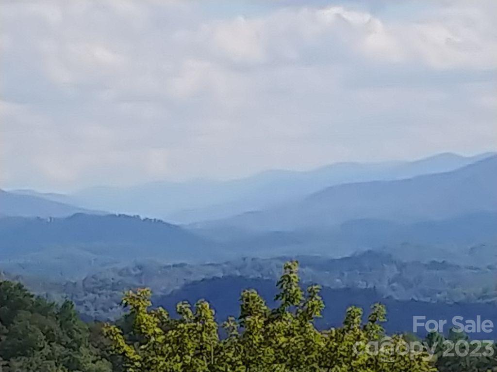 an aerial view of a city and mountain view in back