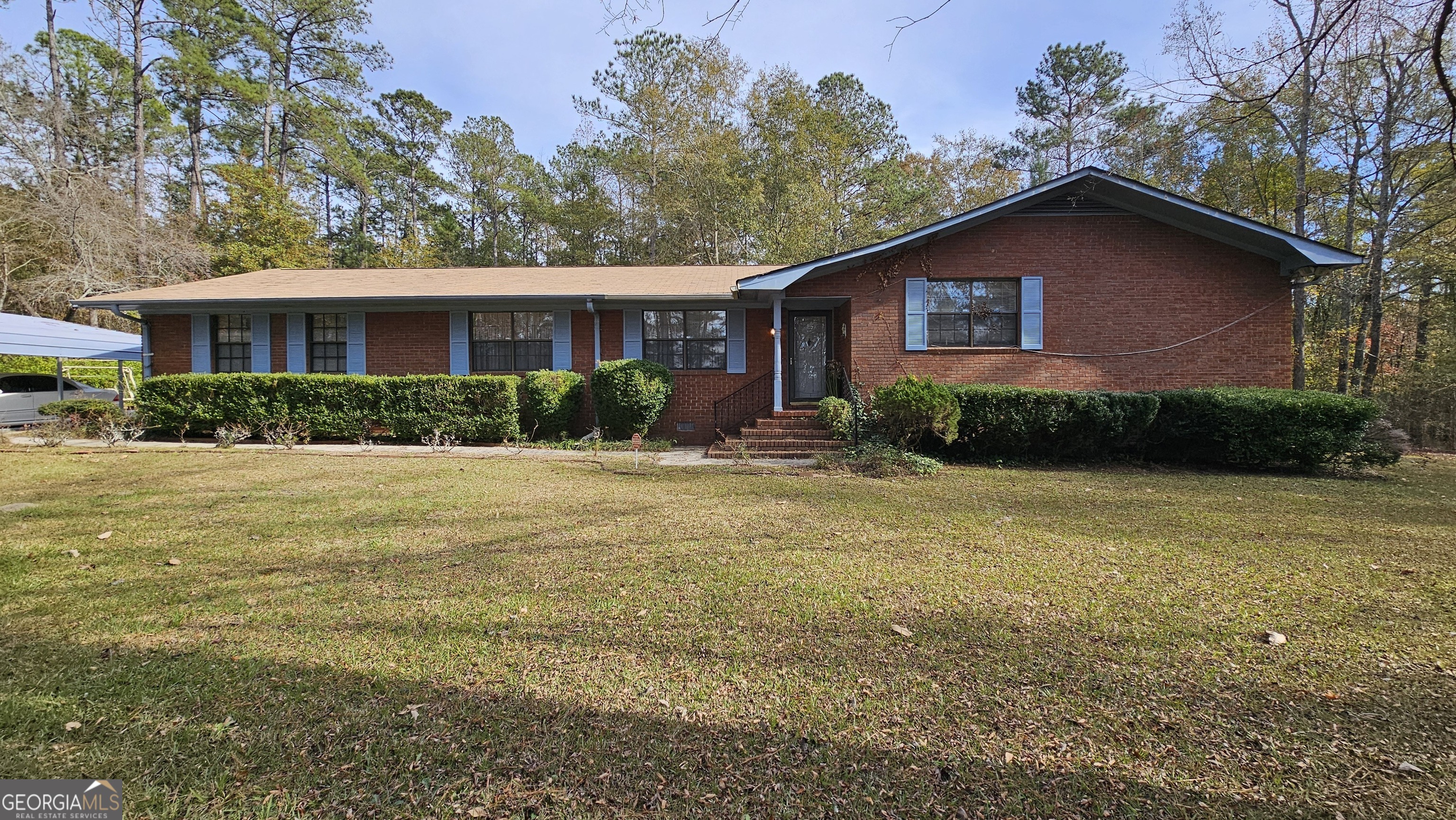 a front view of a house with garden