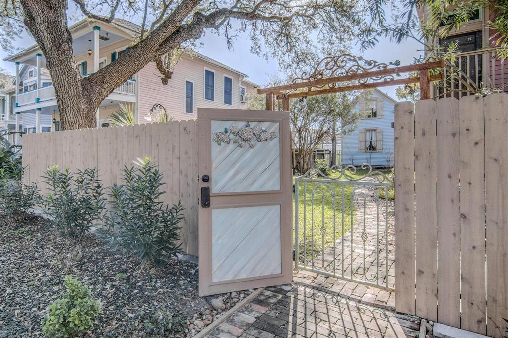 a view of a house with a door and tree