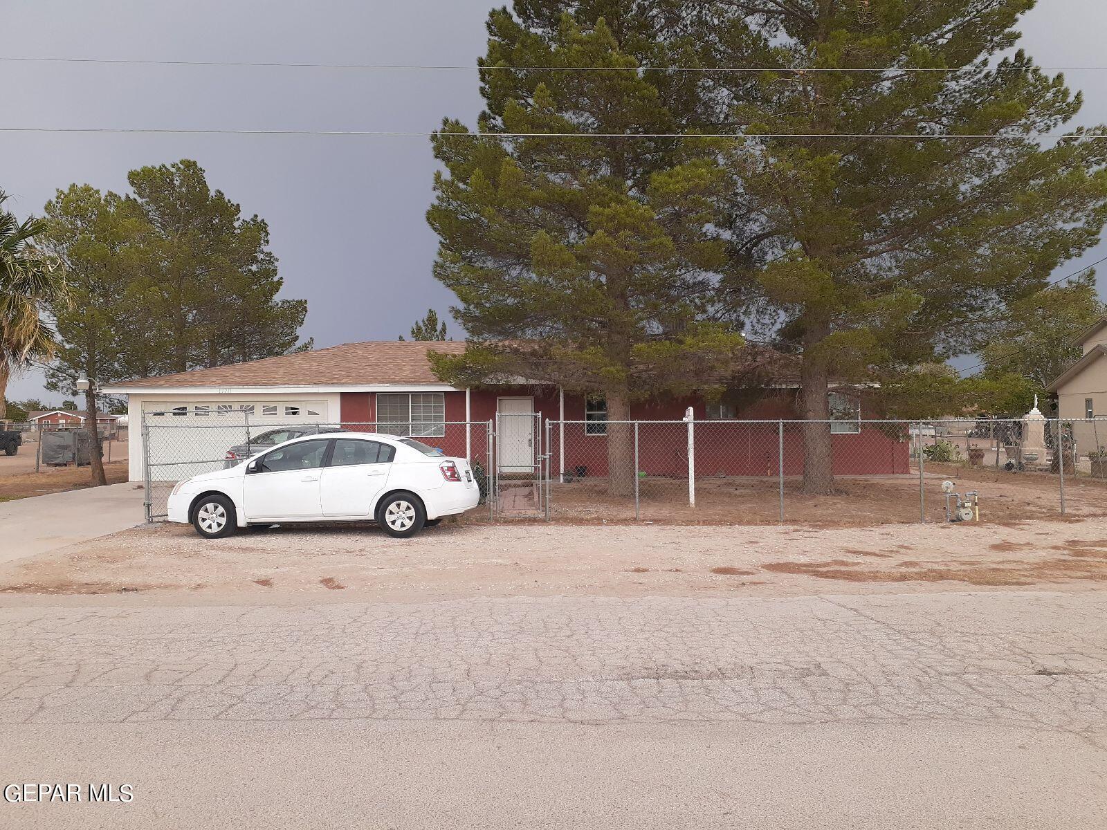 a view of a cars parked in front of a house