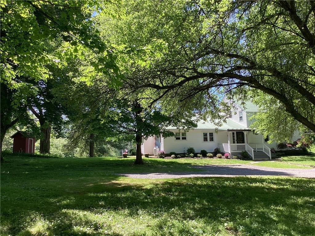 a view of a house with a big yard