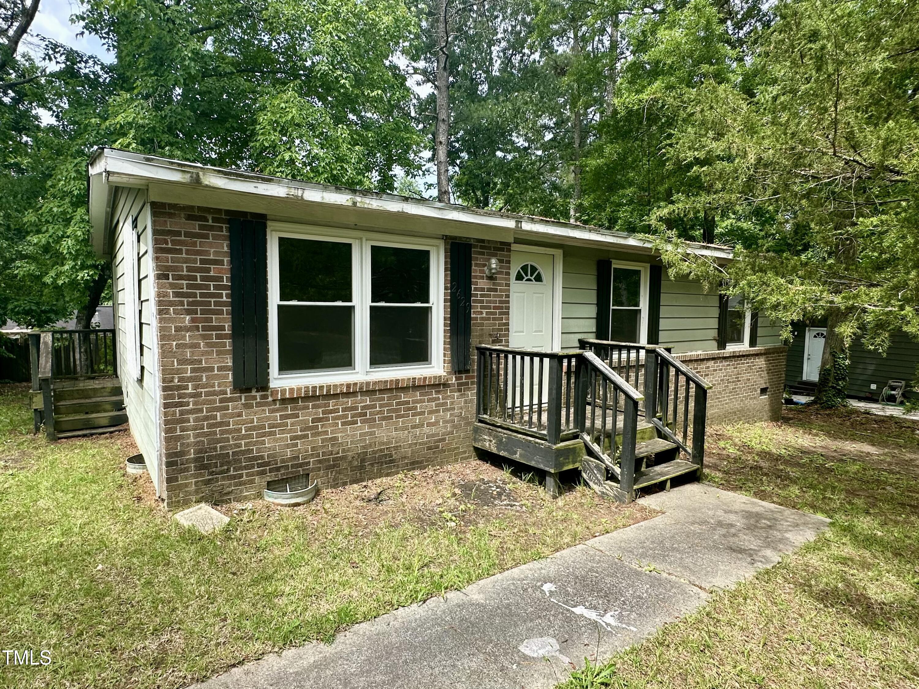 front view of a house with a yard