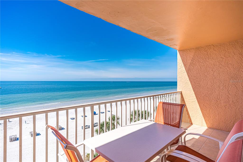 a view of a balcony with chair