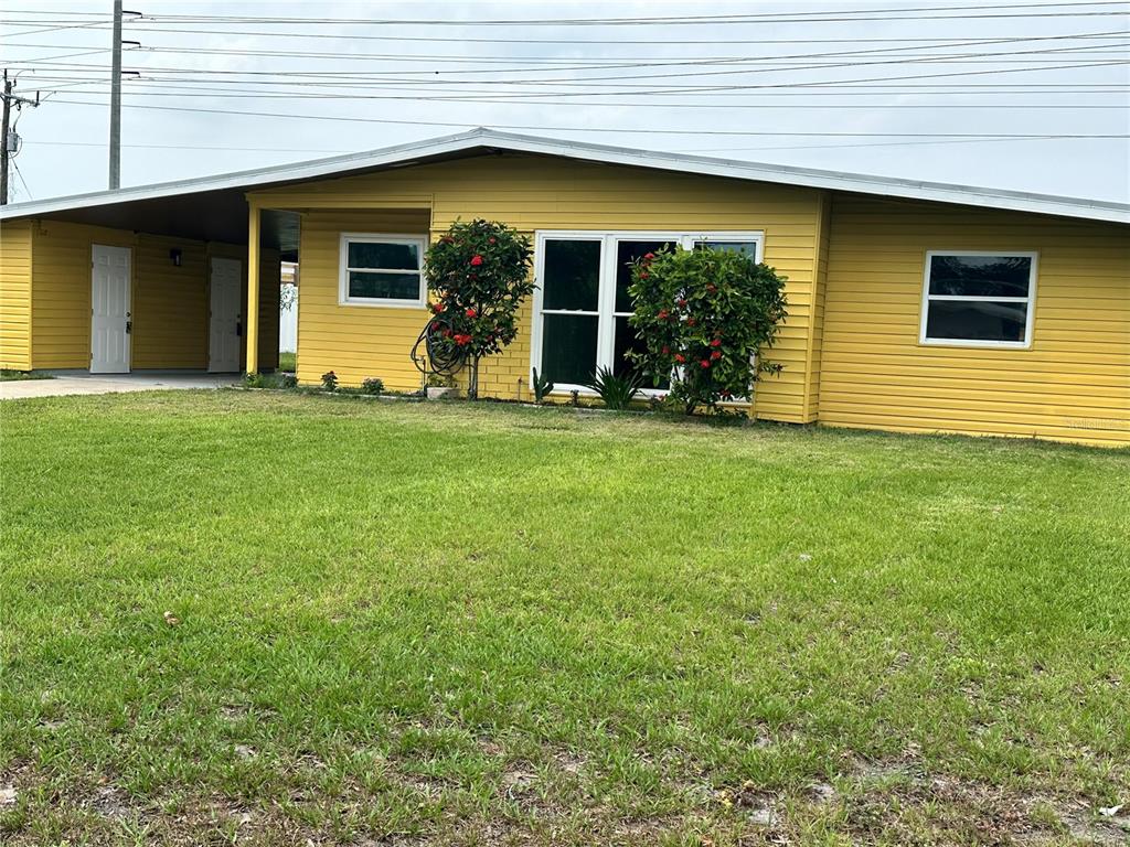 a view of a backyard of the house