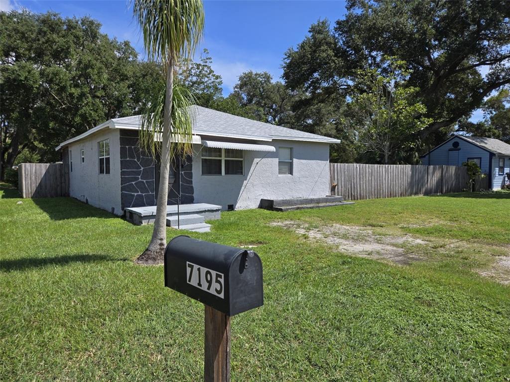 a front view of house with yard and seating area