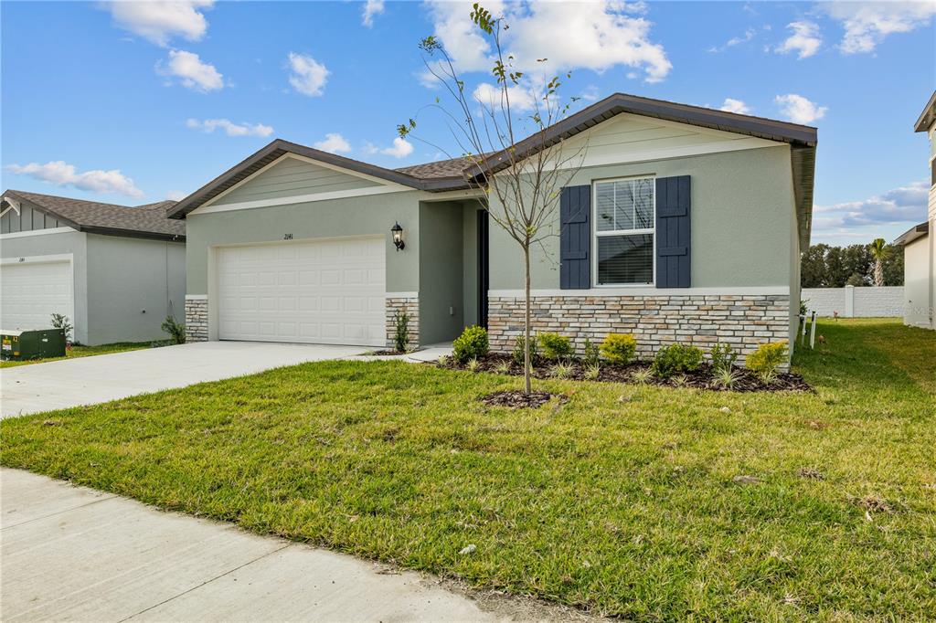 a front view of a house with a yard