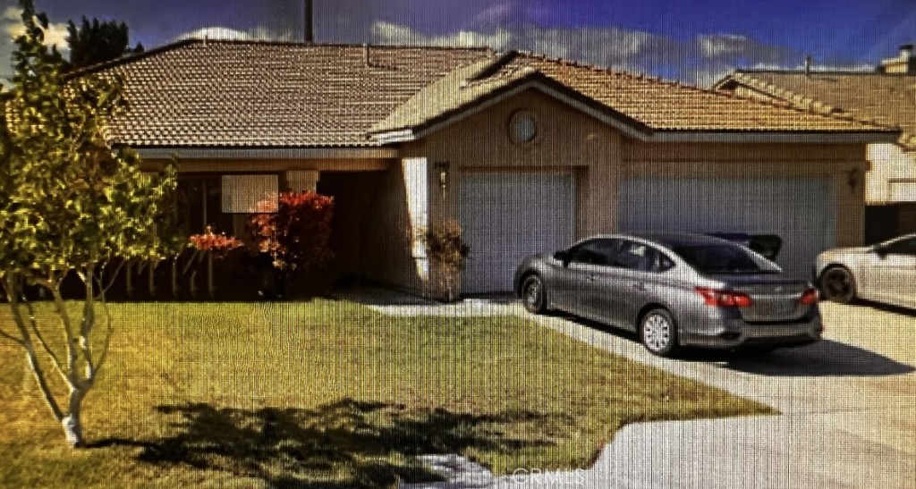 a front view of a house with parking space