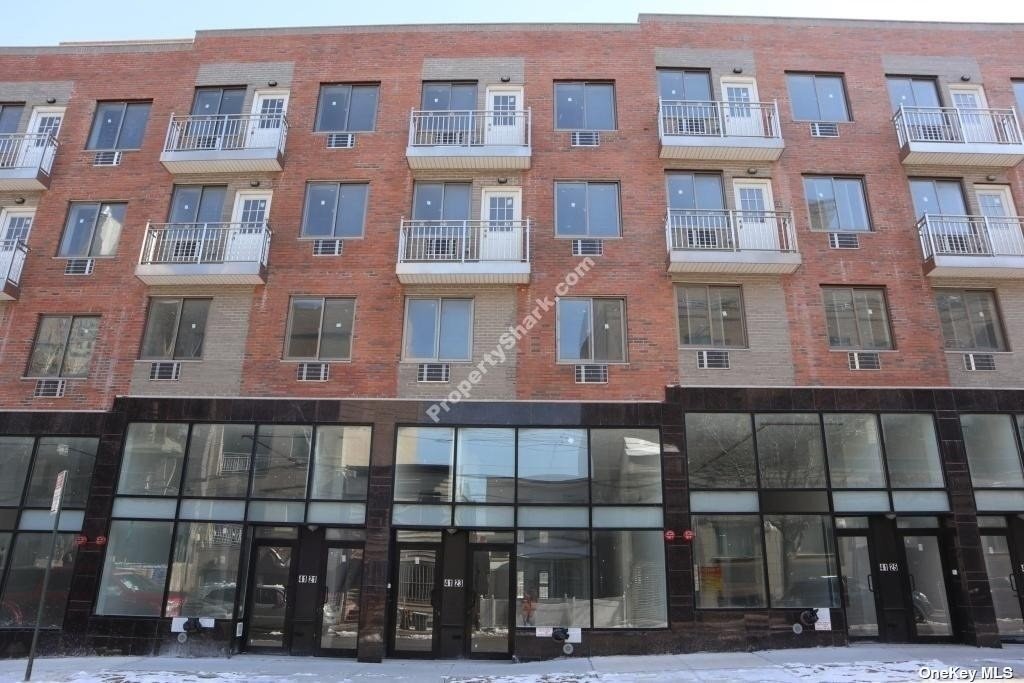 a front view of a building with glass windows