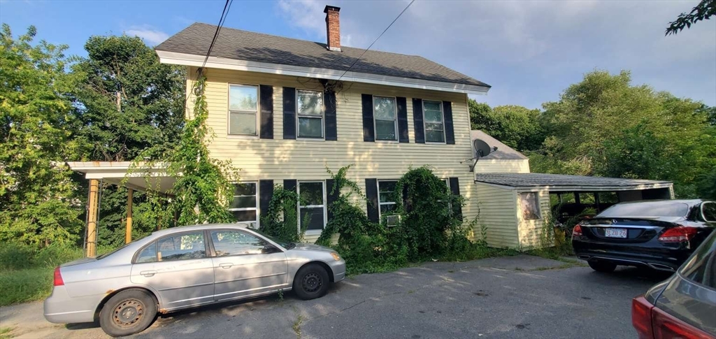 a view of a car parked in front of a house