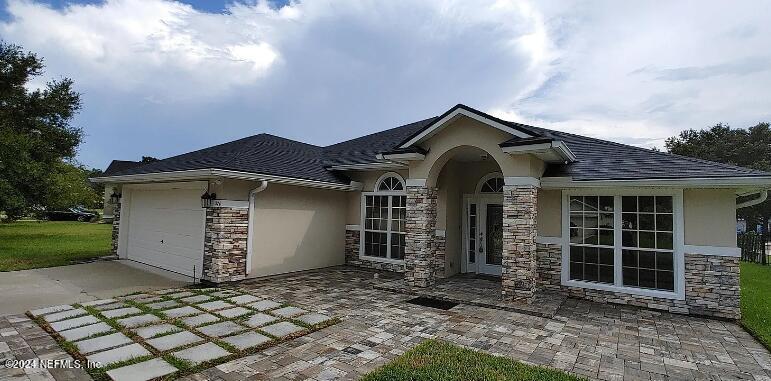 front view of a house with a yard