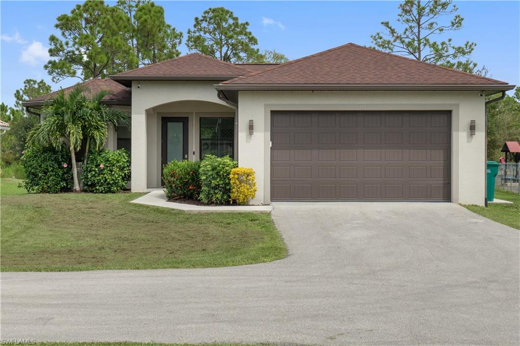 a front view of a house with garden