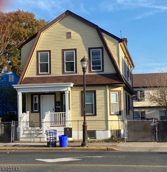 a view of a house with a street