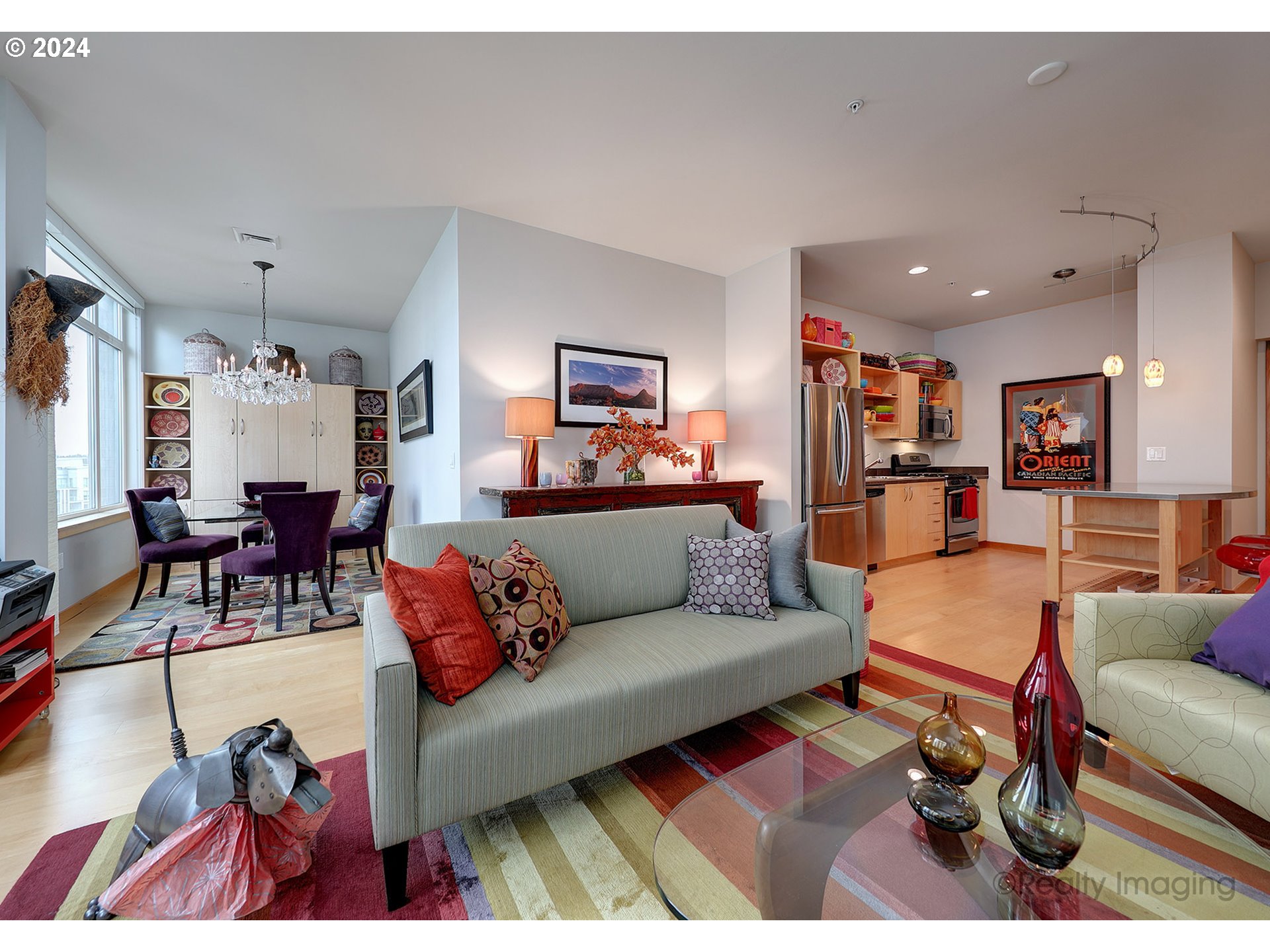 a living room with furniture and kitchen view