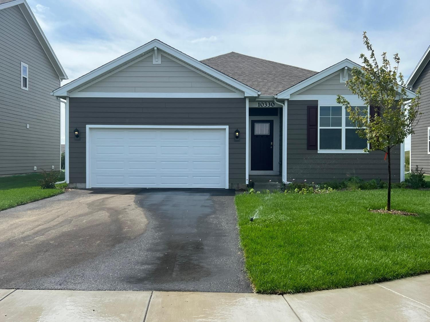 front view of a house and a yard