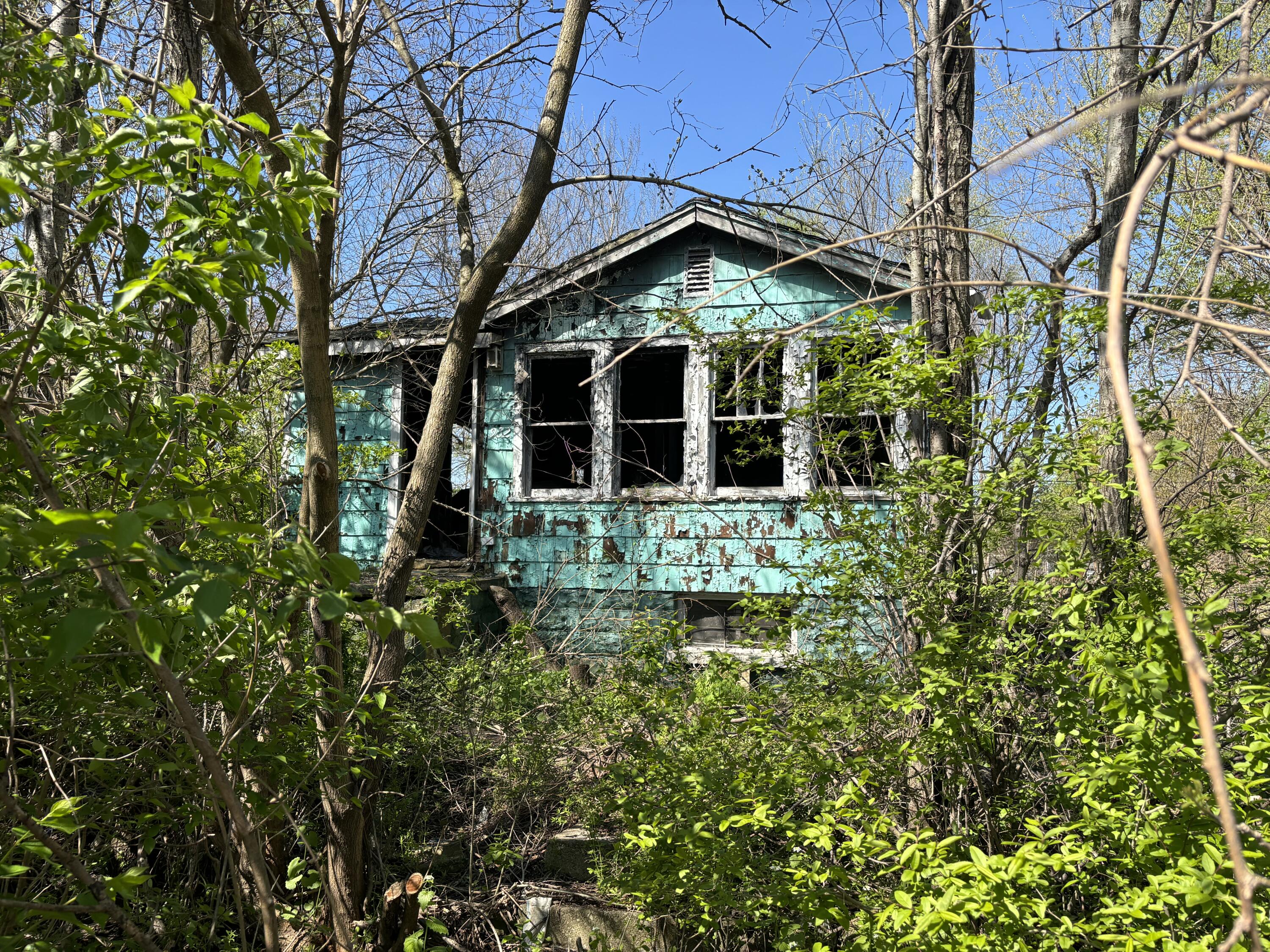 a view of a house with a small yard