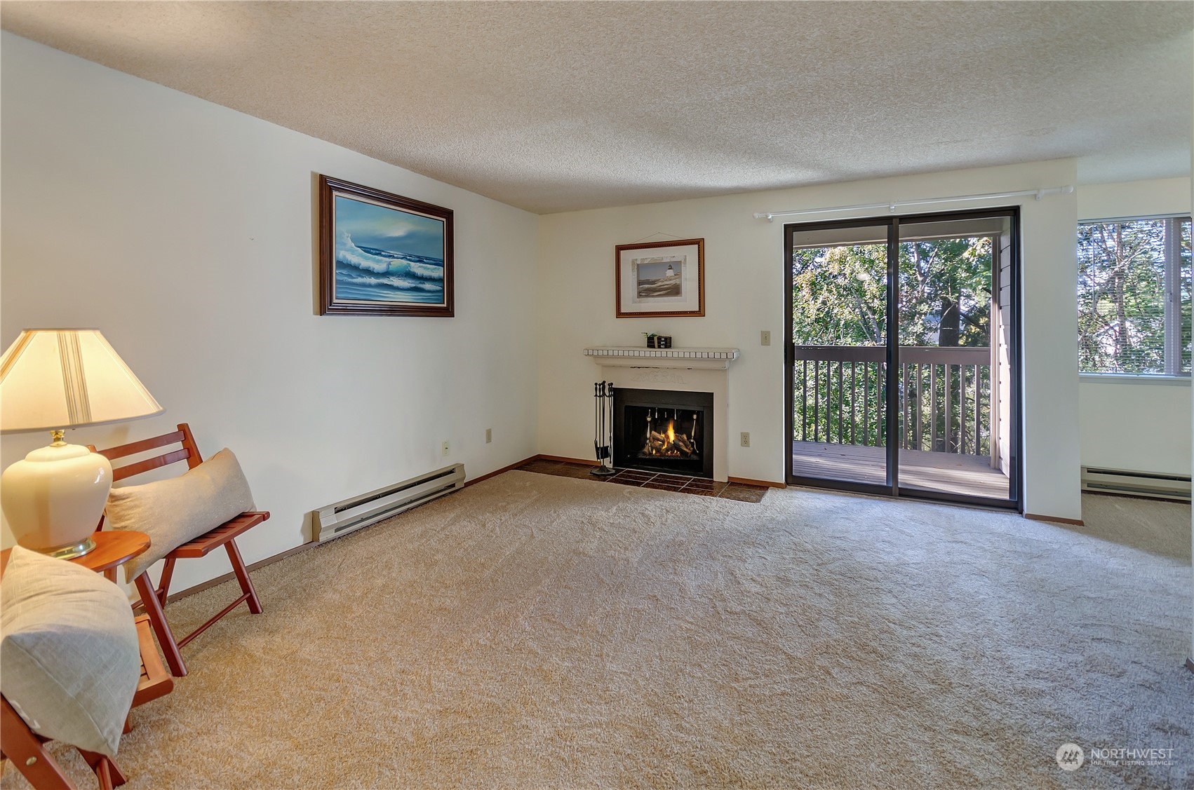 a view of a livingroom with furniture and a fireplace