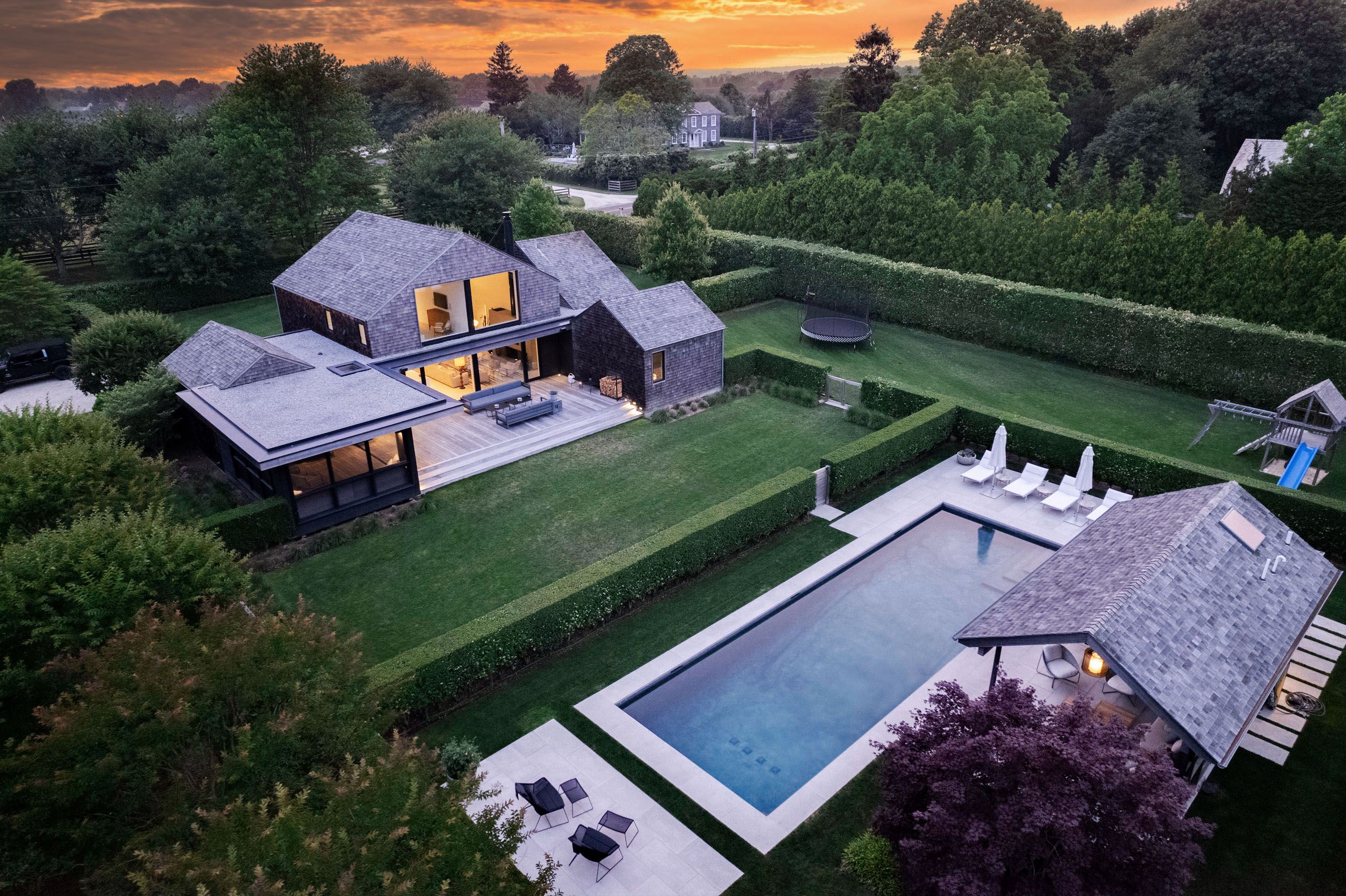 an aerial view of a house with big yard