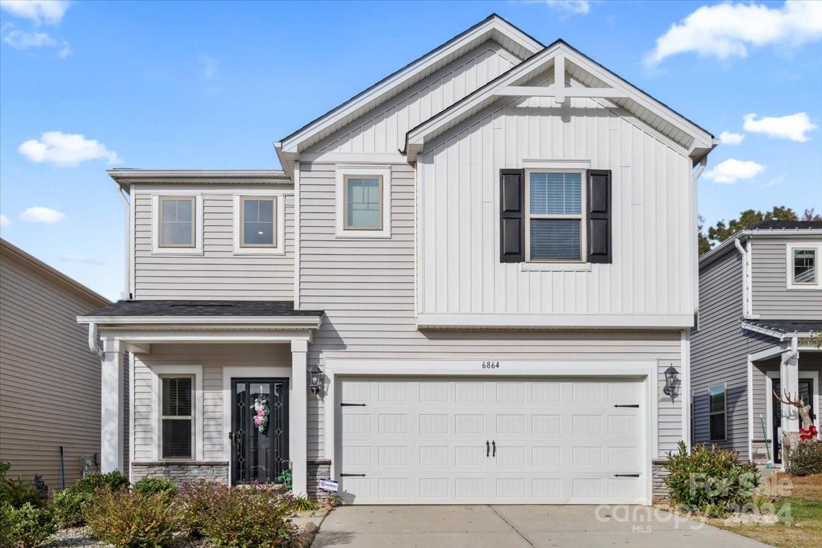 a front view of a house with a garage