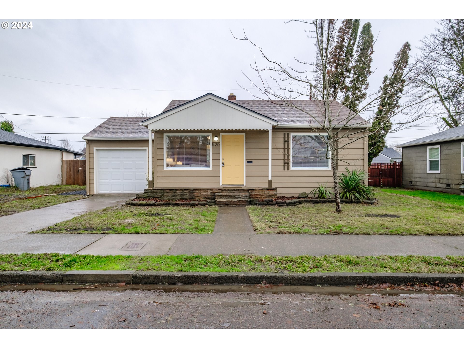 front view of a house with a yard