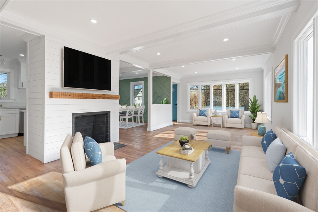 a living room with fireplace furniture and a flat screen tv